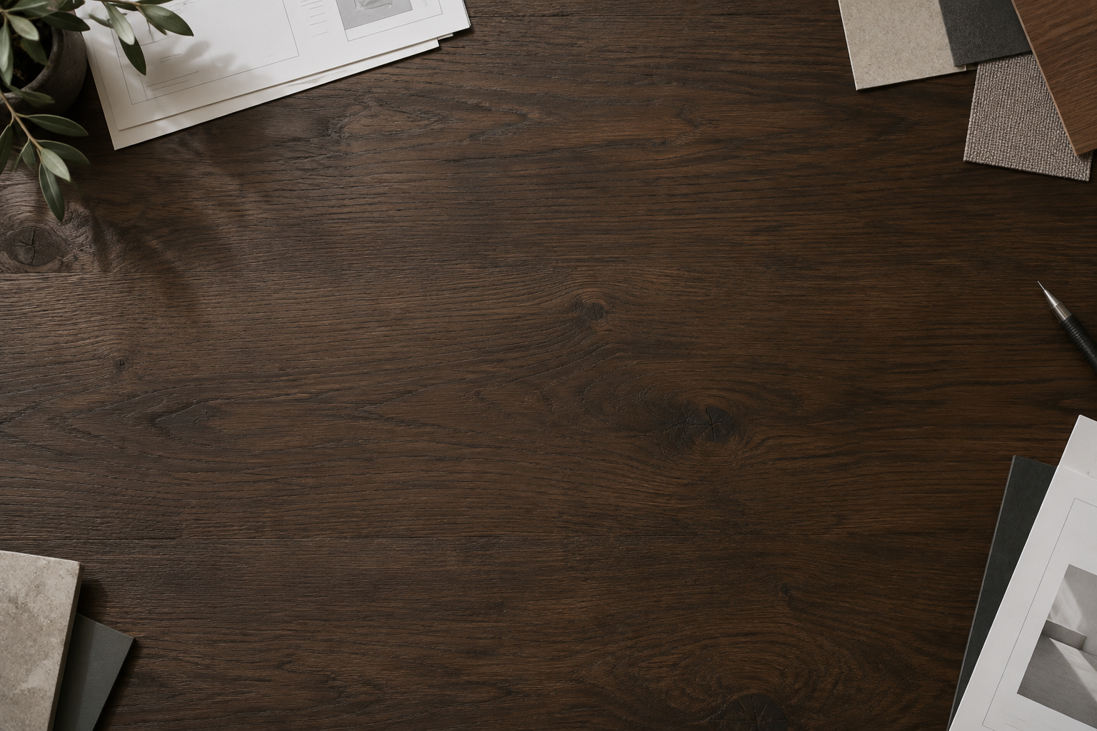 Editorial worktable with paper proofs and material samples